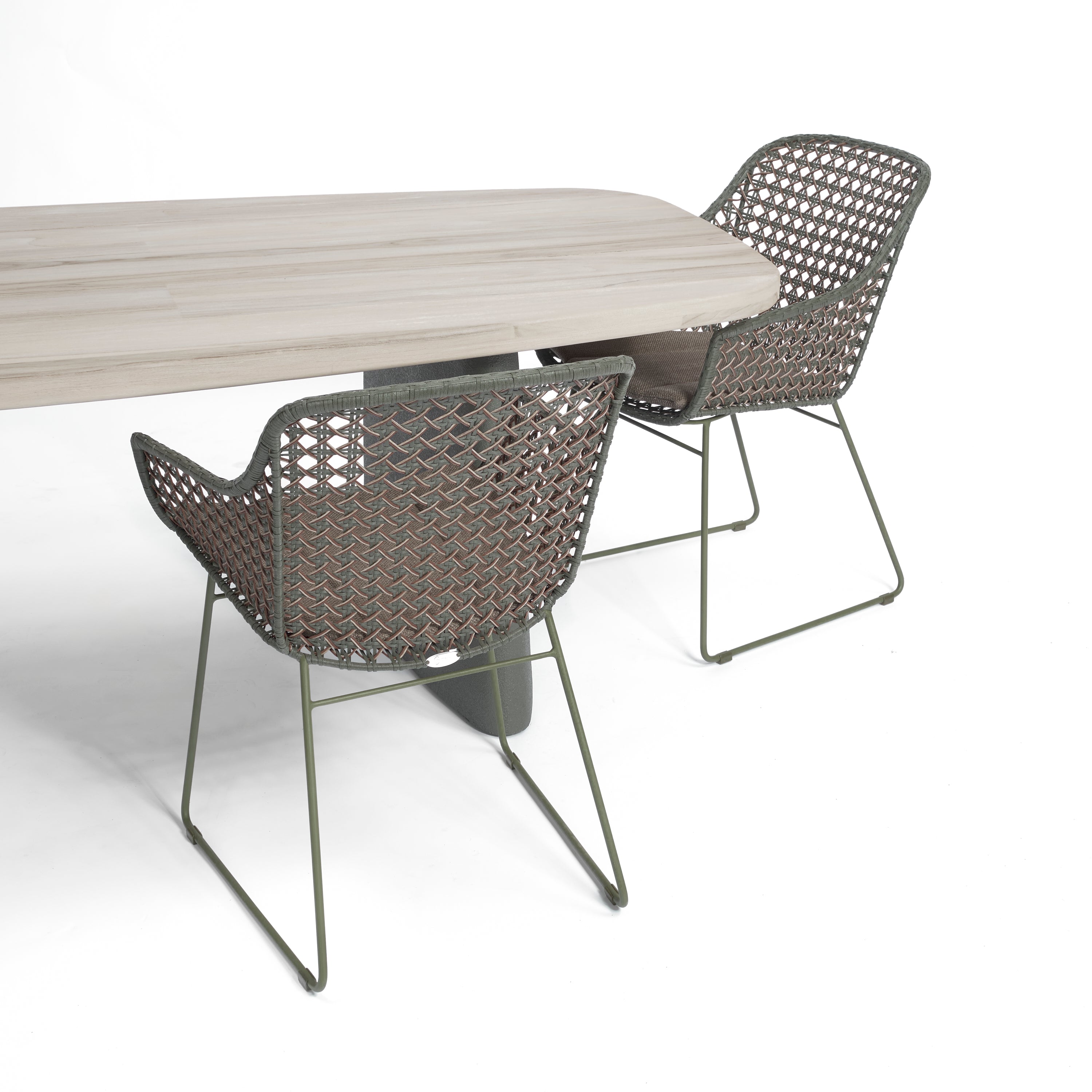 A solid teak table with two Sissonne Outdoor Mollymook Dining arm chairs
