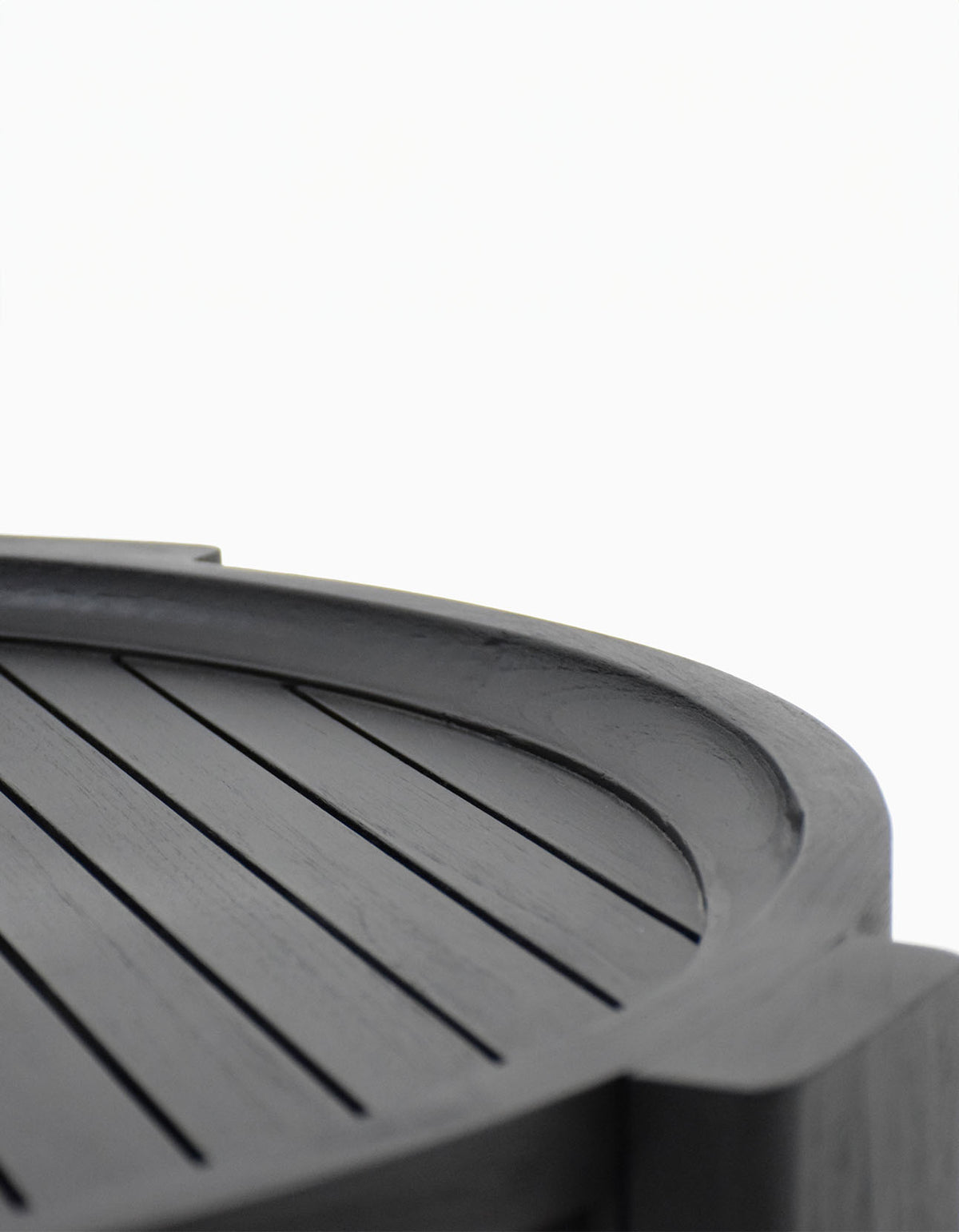 Wategos Coffee Table in black teak, close-up of the slatted top and raised rim