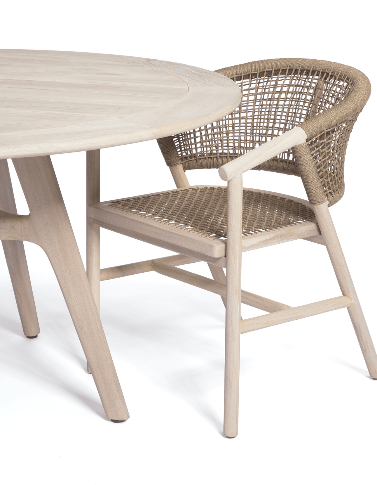 A solid teak table with the Sissonne Outdoor Shelley Dining chair in teak