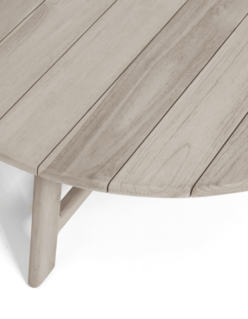 A close up shot of a solid teak table top