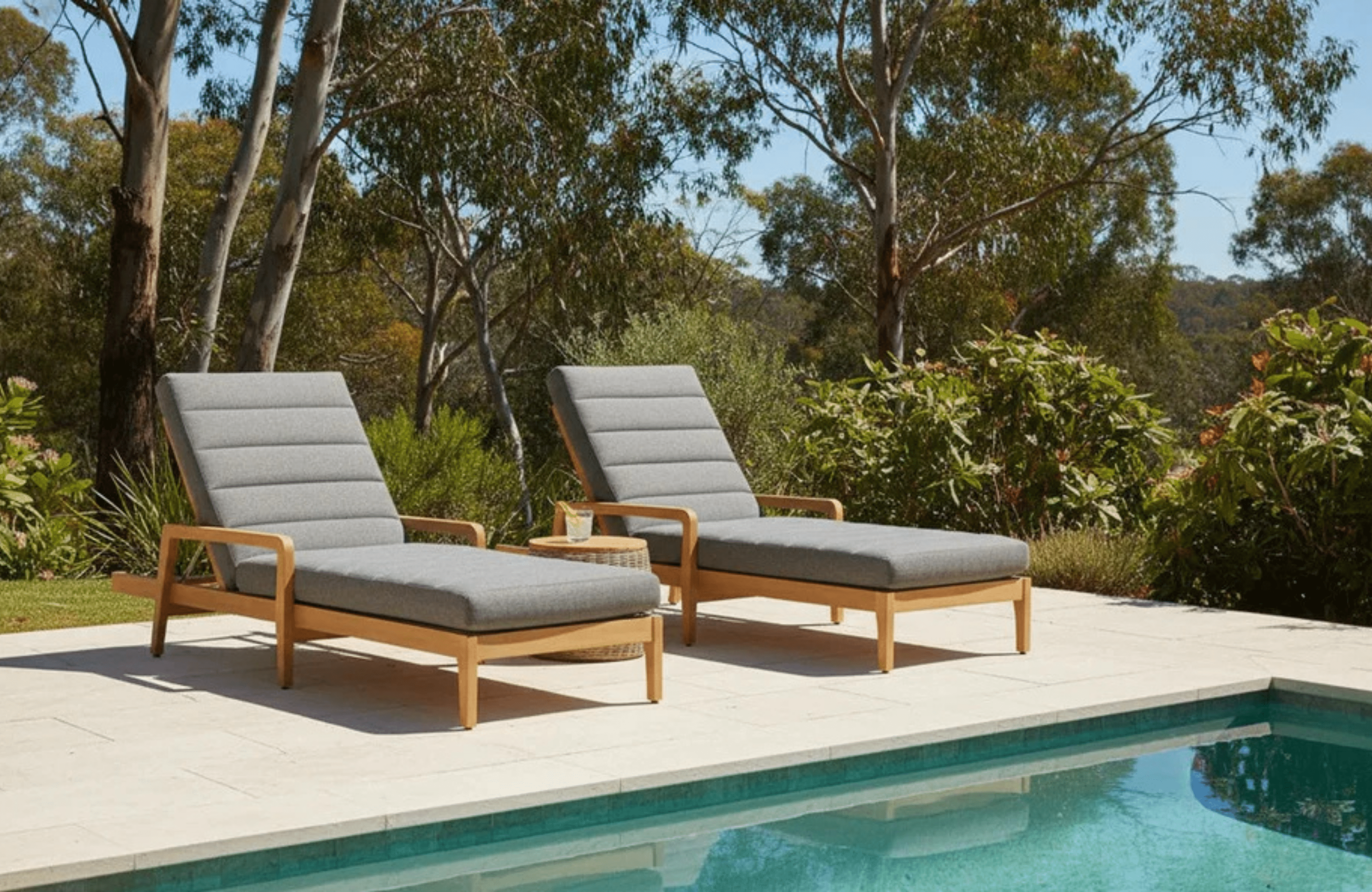Burleigh Sissonne Outdoor Teak Sunloungers by pool