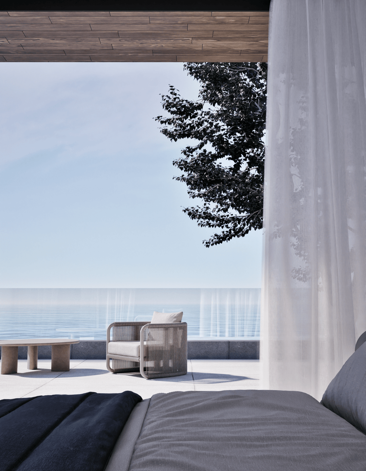 Capri Lounge Chair in Dove Grey on a terrace overlooking the ocean